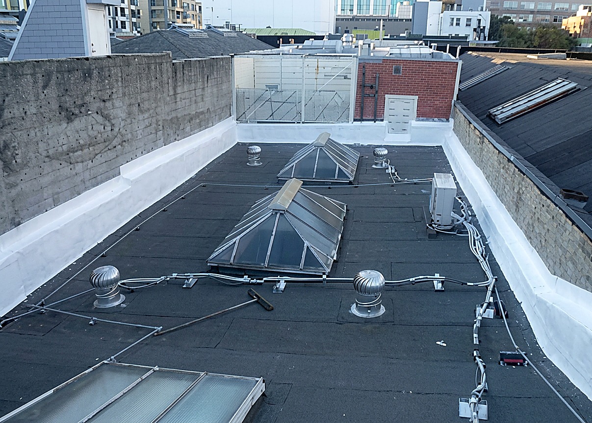 Flat roof with skylights — completed SF building